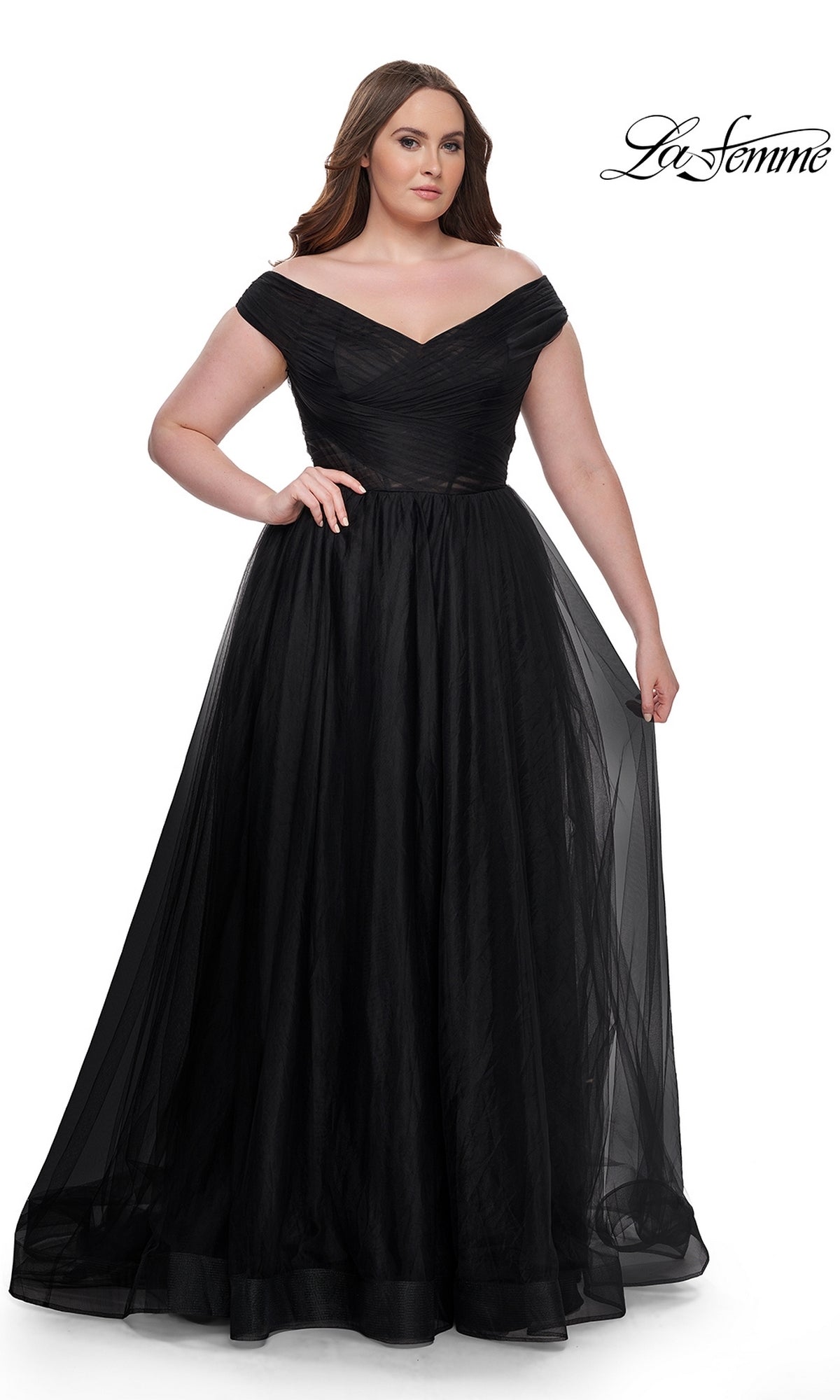 A woman wears the La Femme Plus-Size Long A-Line Prom Dress 32204, an off-the-shoulder gown with a fitted bodice and full tulle skirt, standing against a white background. The "La Femme" logo appears in the top right corner.