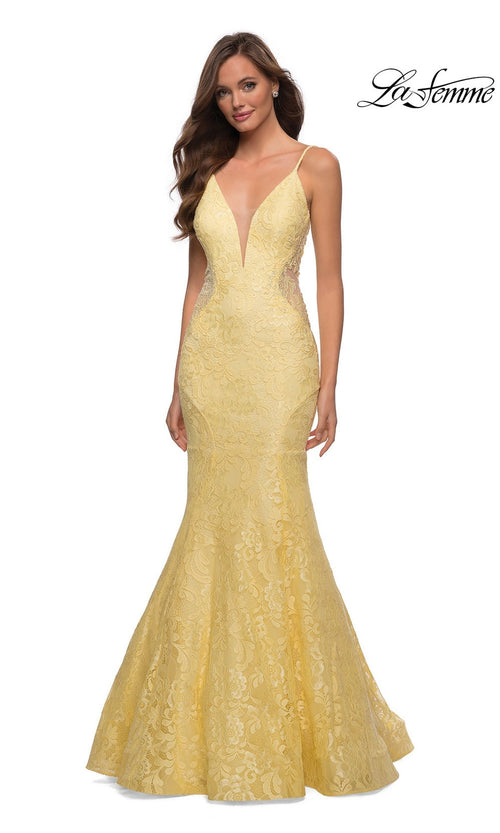 A woman models the La Femme Backless Long Lace Prom Dress 28355 in yellow, featuring a mermaid skirt, deep V neckline, and thin straps against a white background. The La Femme logo is shown in the top right corner.
