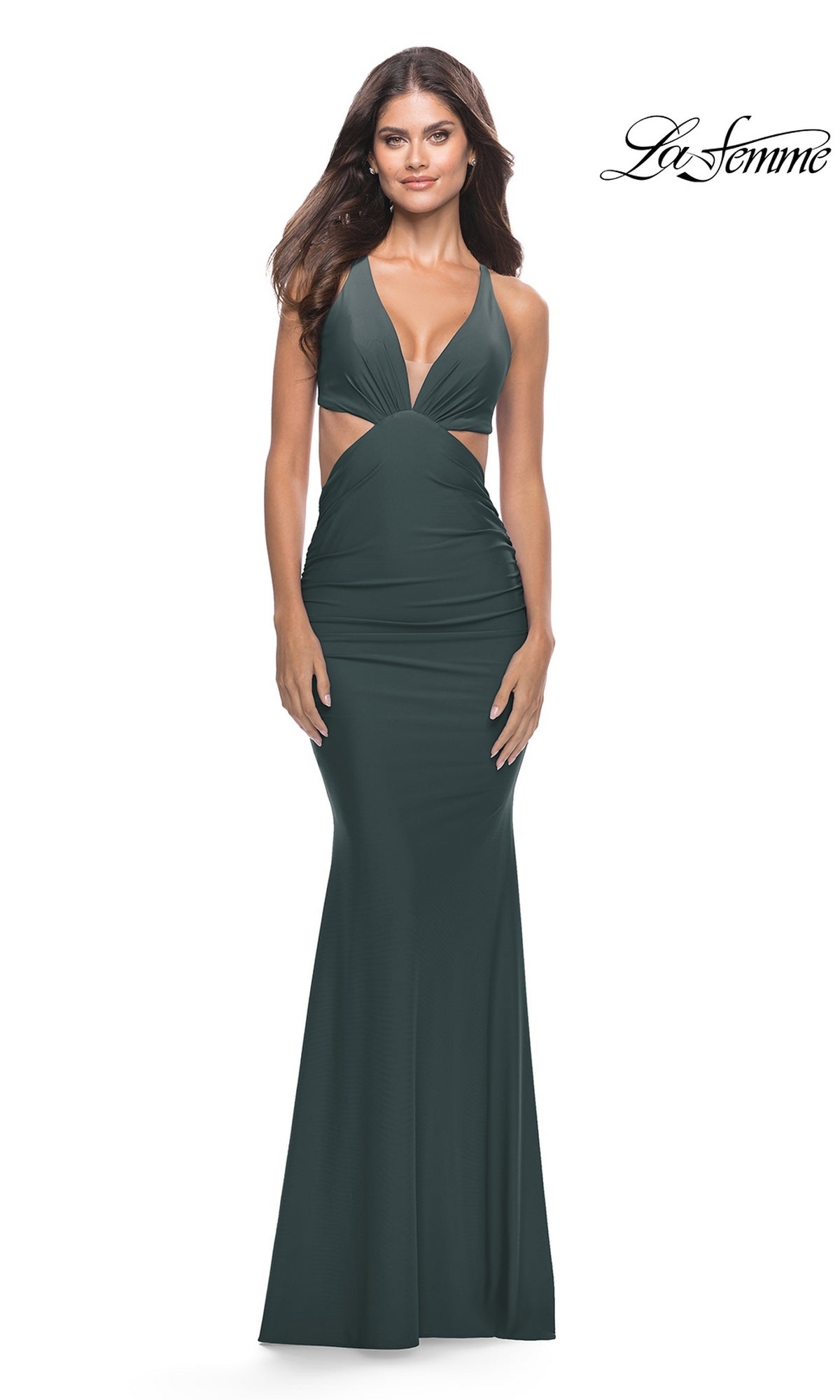 Model wearing the La Femme V-Neck Cut-Out Tight Prom Dress 31228 in dark green, featuring a ruched design, deep V-neckline, and sleeveless style, posing against a white background.