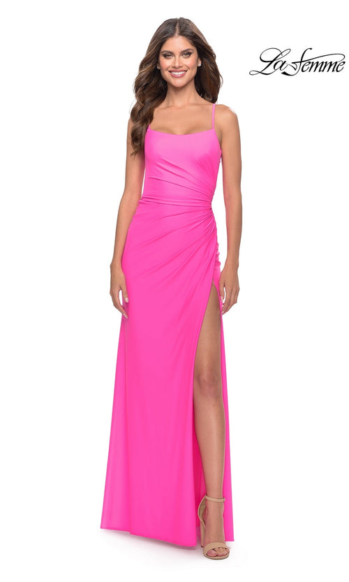A woman smiles in the La Femme Side-Slit Backless Long Prom Dress 31329 in neon pink with nude heels. The La Femme logo appears in the top right corner.