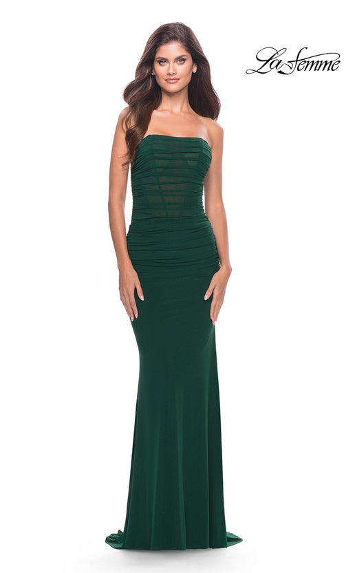 A woman models the Simple Strapless Long Prom Dress: La Femme 31584 in fitted dark green, standing forward against a white backdrop. The La Femme logo is featured in the top right, emphasizing this elegant formal gown.