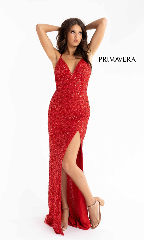 A woman in a red Backless Tight Long Sequin Prom Dress 3291D with a thigh-high slit poses with arms raised and crossed behind her head; "PRIMAVERA" appears beside her.