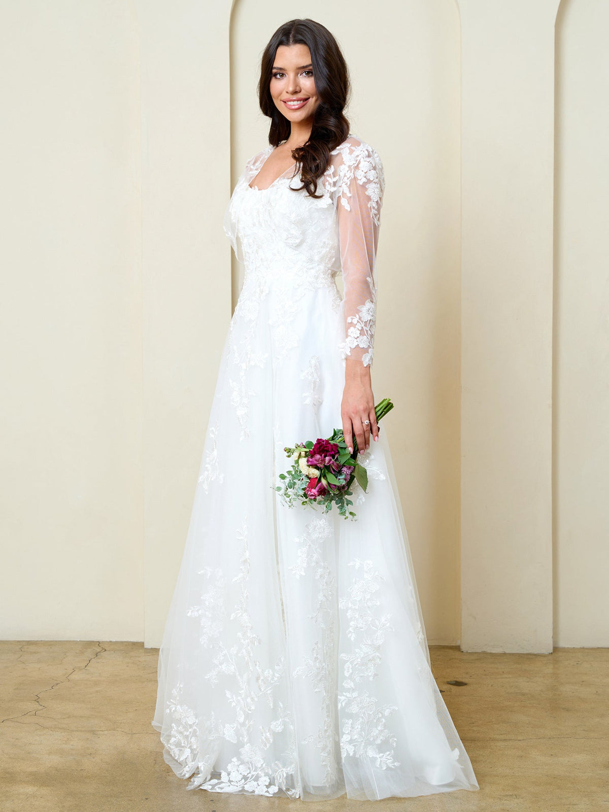 Eva USA Off White Luxurious tulle with dimensional floral lace applique Classic A-line design that enhances natural curves...