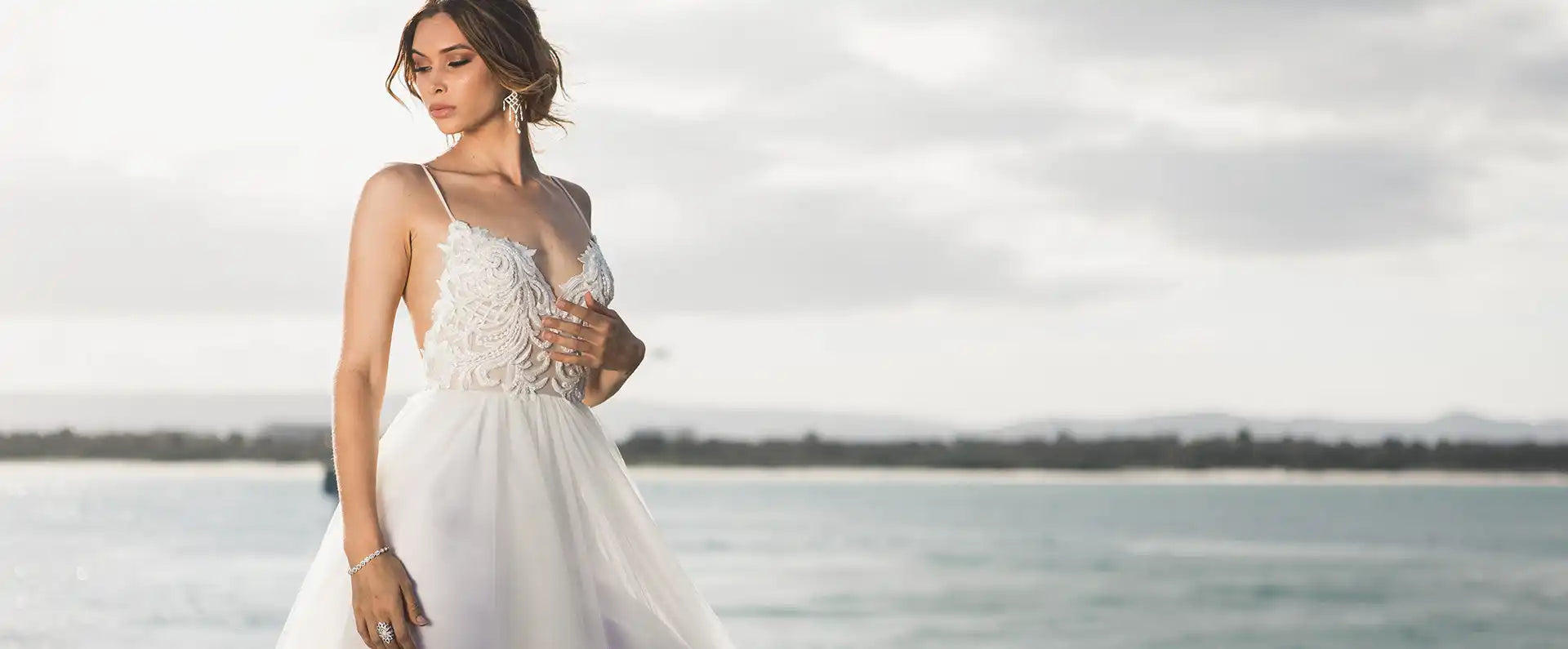 Elegant white wedding dress with a delicate lace bodice and flowing skirt.