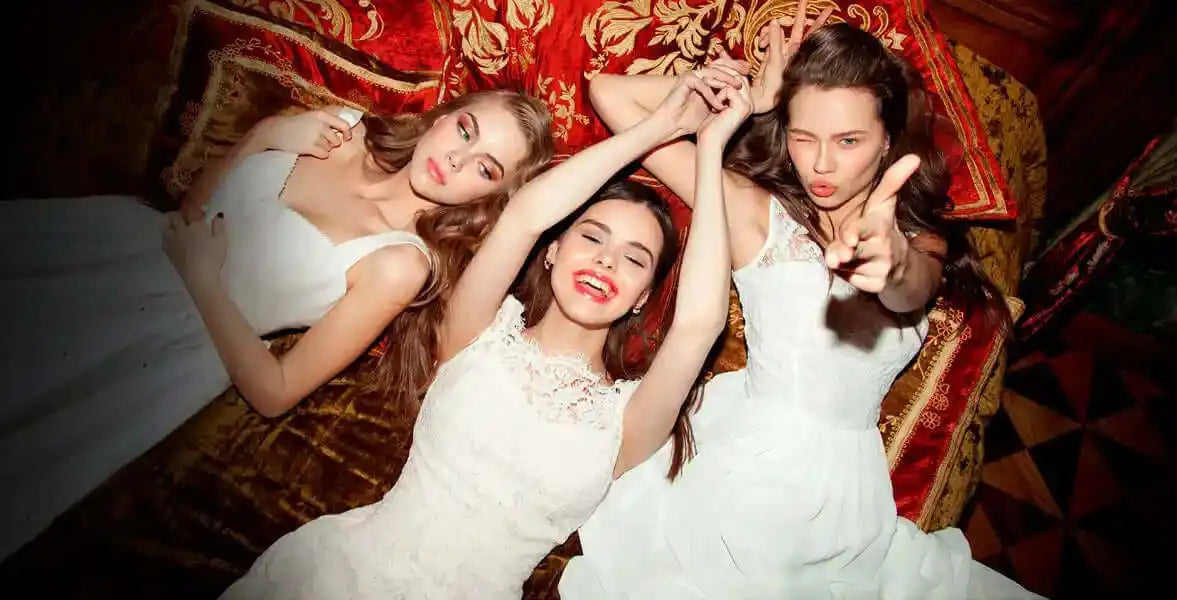 Three women in white dresses.